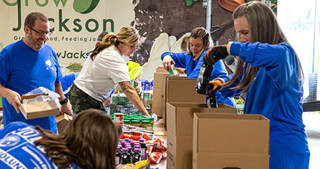 Volunteers packing food for the needy